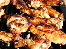 grilled chicken wings being cooked